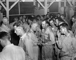 Admiral William Halsey, center, at a United States Navy officers’ social function, probably late 1943 at Espiritu Santo, New Hebrides.