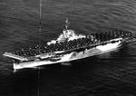 USS Bennington steaming out of San Diego, California en route Pearl Harbor, Hawaii with a deck load of aircraft, 1 Jan 1945.