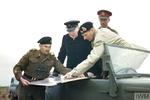Bernard Montgomery showing Winston Churchill a map held by Gen GG Symonds, during Churchill