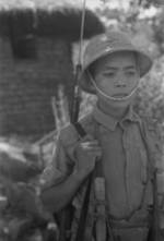 Young Chinese military cadet standing guard with ZB vz. 24 rifle, Hubei Province, China, 1942, photo 2 of 2