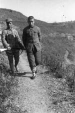 Chinese soldier with Hangyang type 88 rifle guarding a Japanese prisoner of war, Changde, Hunan Province, China, 25 Dec 1943, photo 1 of 2