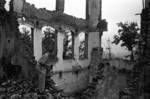 Harrison Forman in a ruined section of Chongqing, China, 1942, photo 3 of 4