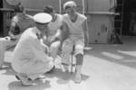US Navy officer speaking to sailors injured by an errant Chinese anti-aircraft shell, USS Augusta, Shanghai, China, 21 Aug 1937, photo 2 of 3