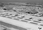 Aerial view of the tower, hangars, and pad at Borinquen Field, Puerto Rico, 1943. Aircraft seen include C-46, C-47, C-54, B-17, B-25, B-18, B-34, A-20, and perhaps others.