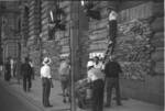 Men protecting windows with boards and sandbags, Bund area, Shanghai, China, mid-1937, photo 2 of 2