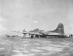 B-17E Fortress on an RAF airfield in Tunisia. Note irregular camouflage paint scheme and 417 Sq. RCAF Spitfire at left. This was the bomber given to Montgomery by Eisenhower. Photo taken shortly after 17 Apr 1943.