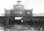 American troops at the main gatehouse of the Buchenwald Concentration Camp, circa Apr 1945.