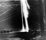 Thought to be the only photograph taken during the nighttime bombing attack on American B-17 bombers at Poltava, Ukraine, 22 Jun 1944 during Operation Frantic. The bright streaks are likely flares to light up the field.