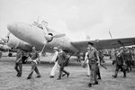 Japanese surrender envoys led by General Numata Takazo escorted by British officers at Mingaladon airfield, Rangoon for the surrender of the Southern Army in Burma, 28 Aug 1945. They arrived in a Mitsubishi Ki-57 ‘Topsy’
