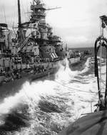 Battleship USS Massachusetts refueling in the Philippine Sea from the oiler USS Kaskaskia, 18 Oct 1944. Note Massachusetts’ starboard twin mount 5”/38 caliber guns at their full 85-degree elevation.