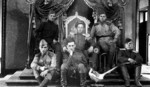 Soviet soldiers posing at the throne of Emperor Kangde of the Japanese puppet state of Manchukuo, Xinjin (Changchun), Jilin Province, China, Sep 1945