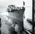 The cruiser Nashville began slipping down the ways after several nervous, motionless moments following christening at the New York Shipbuilding Corporation in Camden, New Jersey, United States, 2 Oct 1937.