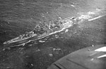 Aerial view of the cruiser USS Nashville underway, Pacific 1944