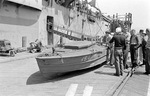 A captured Japanese Shinyo-class suicide boat on the dock after being hoisted off USS Pinkney that brought it to the United States for analysis, Alameda, California, United States, Jun 1945.