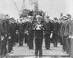 Commander Joseph Willingham reading his orders to assume command of submarine USS Bowfin at her commissioning, 1 May 1943, Portsmouth Navy Yard, Portsmouth, New Hampshire, United States.