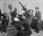 WAAF technician projecting targets for an RAF Regiment anti-aircraft gunnery trainee, RAF Leuchars, Scotland, United Kingdom, 1940s