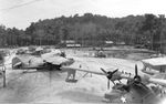 United States Navy aviation maintenance area in the South Pacific servicing several PBY Catalinas as well as other seaplanes in the background, 1942-43.