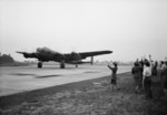 WAAF personnel and ground crew members waving off Pilot Officer W. H. Eager RCAF and his crew of a Lancaster B Mark I bomber of No. 61 Squadron RAF, RAF Syerston, Flintham, Nottinghamshire, England, United Kingdom, 1942-1943; this bomber was later lost during a raid on Mannheim, Germany on 10 Aug 1943