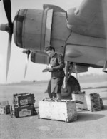 A WAAF corporal checking a delivery of 20mm Hispano cannon shells before being loaded onto a Beaufighter Mark VI aircraft of No. 96 Squadron RAF at RAF Honiley, Wroxall, Warwickshire, England, United Kingdom, 1943-1945
