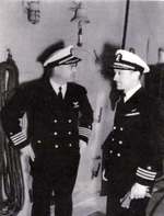 Change of Command ceremony aboard USS Card, Captain Arnold J. “Buster” Isbell, left, relieved Captain James Sykes at Norfolk, Virginia, 17 Apr 1943.