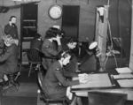 RAF and WAAF personnel working in the wooden receiver hut at RAF Ventnor, Isle of Wight, England, United Kingdom, date unknown
