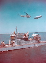 German submarine U-858, the first to be boarded by US forces after Germany’s surrender, arriving at the Delaware Capes, Delaware, United States, 14 May 1945. Note Sikorsky HNS-I Helicopter and K-class airship.