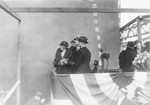 United States First Lady Mrs. Lou Hoover christening Ranger upon the ship’s launch at Newport News, Virginia, 25 Feb 1933. Behind Mrs. Hoover, in the dark hat, is Secretary of the Navy Charles Adams. Photo 1 of 2.