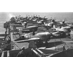 P-40L Kittyhawk fighters of the USAAF 58th Fighter Group on the flight deck of USS Ranger bound for West Africa, late Feb 1943. Note the dark protective coating painted on the canopies.