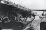 Carrier USS Ranger as seen from destroyer USS DeHaven as they steamed from the Panama Canal toward San Diego, California, 22 Jul 1944. Note the life rafts stacked in bundles of three.