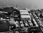 USS Corregidor ferrying trucks, jeeps, and aircraft, mid-1940s