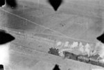 Gun camera view of a P-51 fighter preparing to strafe a train on the Pinghan Railway (now Beijing-Hankou Railway), Hebei Province, China, Apr 1945