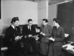 WRNS, ATS, and WAAF officers receiving instructions from British Royal Navy Paymaster Commander Stanning aboard HMS Bulolo while the ship was off Casablanca, Morocco, circa 14 Jan 1943