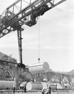 Cranes hoisting floats for submarine nets at the United States Tiburon Naval Net Depot, Tiburon, California, United States, Apr 1941.