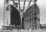 Merchant ship Kandelfels being prepared for launch, Deschimag shipyard, Bremen, Germany, early Nov 1936; note Kybfels under construction on the right of the photograph