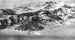 1942 aerial view of Sausalito, California, United States with Wolfback Ridge behind the town and the early stages of the Marinship yard at right. The Golden Gate Bridge is out of frame to the left.