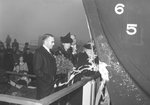 The seventh ship constructed by CalShip, Liberty-ship Robert Morris, is christened by Mrs. Margaret McCone, wife of CalShip president John A McCone (left), 28 Jan 1942, Los Angeles, California, United States.