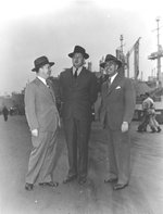 Stephen Bechtel, J. A. Krug, and John A. McCone on a tour of the CalShip yard, Los Angeles, California, United States, 14 Dec 1944. Krug was the Chairman of the War Production Board.