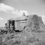Royal Corps of Signals motorcycle despatch riders arriving at the mobile headquarters of an armoured division during training, United Kingdom, 30 Aug 1941