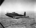 XFL Airabonita prototype aircraft in flight, 16 Jul 1940, photo 1 of 2