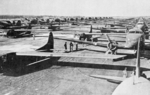 CG-4A gliders and C-47 Skytrain tow planes lined up on a French airfield in preparation for Operation Varsity, 24 Mar 1945.