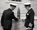 Canadian Chief of Naval Staff Vice-Admiral Percy Nelles inspecting a Japanese shell recovered from the Estevan Point lighthouse shelling attack of 20 Jun 1942 by Japanese submarine I-26.