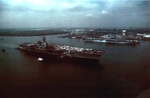 USS Saratoga (foreground) arriving at Philadelphia Navy Yard, Pennsylvania, United States, 1 Oct 1980; note USS Shangri-La (background); seen in Feb 1981 edition of US Navy publication All Hands