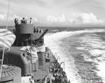 Portside midships of USS Nicholas during a patrol in the Solomon Island “Slot,” 14 Aug 1943. Note the depth charge launchers along the rail.