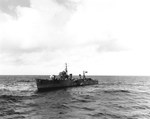 Japanese destroyer Hatsuzakura off Tokyo Bay with a whaleboat from USS Nicholas alongside to transfer Japanese translators and harbor pilots to Nicholas, 27 Aug 1945. Photo 2 of 2.