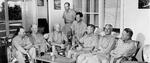 Admiral Chester Nimitz, third from left, with members of his staff on the lanai of his residence on Guam, 1945.