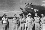 Commander of the 13th Air Force Lt General Nathan Twinning (pith helmet) posing with some of the pilots from the Yamamoto mission, 19 Apr 1943. Lt Rex Barber is at far right next to mission commander Maj John Mitchell.