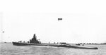 USS Spearfish off Mare Island Naval Shipyard in California on 8 May 1943. The two humps above her engine rooms accommodate newly installed mufflers. Note the deck gun forward and the barrage balloons.