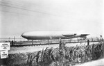 The Goodyear blimp alongside German airship Graf Zeppelin moored at a temporary mooring mast at Mines Field, Inglewood, California after arriving from Japan on her around-the-world flight, 26 Aug 1929.