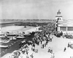 The official dedication ceremonies of the Los Angeles Municipal Airport at Mines Field, Inglewood, California, 7 Jun 1930. Note Marine Corps biplanes, probably Curtiss Jenny’s, on the ramp.