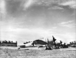 Captured A6M5 Model 52 Zero fighters and one Ki-46 reconnaissance aircraft at the RNZAF airfield at Jacquinot Bay, New Britain, 18 Sep 1945